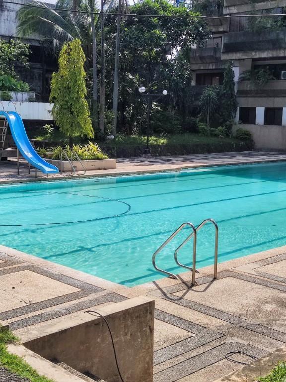 Spacious 2BR Condo with Wide Balcony + Free Parking + Bath Tub in Pansol - Image 7