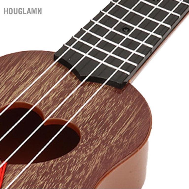 Houglamn RiToEasysports Mini Plastic Ukulele 4 String … in North-Eastern Islands - Image 1