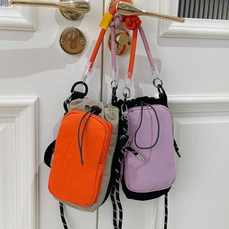 JE Compact Nylon Drawstring Mini Crossbody Bag with Color … in Geylang - Image 1