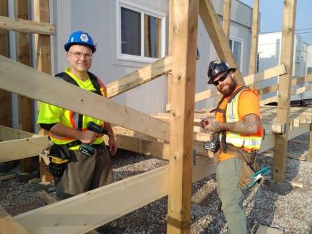 Title Construction Workers Building Structure in Cantonment - Image 1